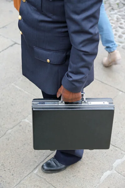 Corruption. Dirty COP with leather glove and the case after paym — Stock Photo, Image