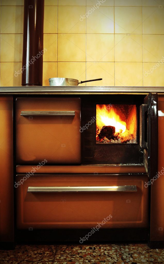 Old Wood Burning Stove In The Kitchen Of Ancient Home Stock