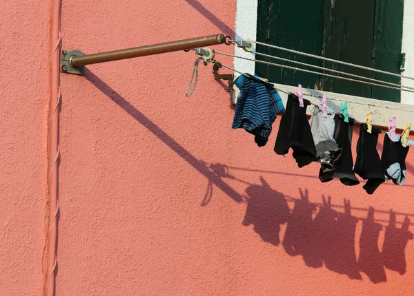 Just washed laundry and lots of clothes hung out to dry — Stock Photo, Image