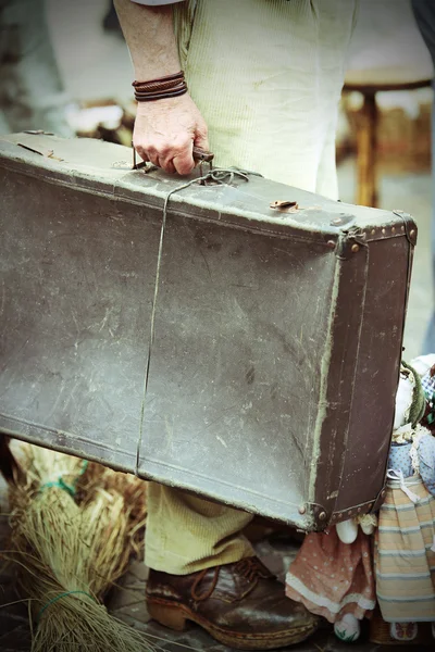 Migrant with leather suitcase waiting to boarding — Stock Photo, Image