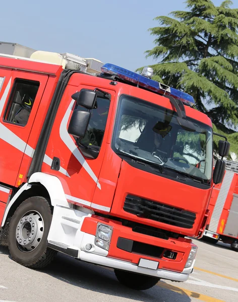 Red fire engine truck on the road — Stock Photo, Image