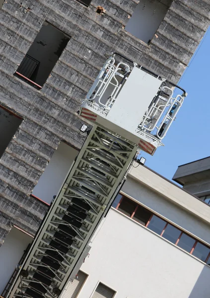 Elevator cage of fire truck with big ladder of firemen — Stock Photo, Image