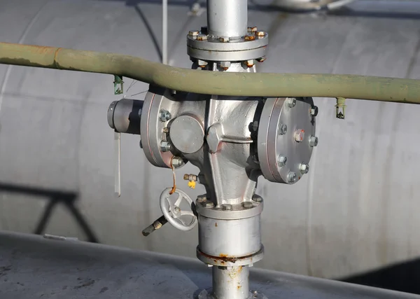 Steel valve over the container under full pressure of gas — Stock Photo, Image