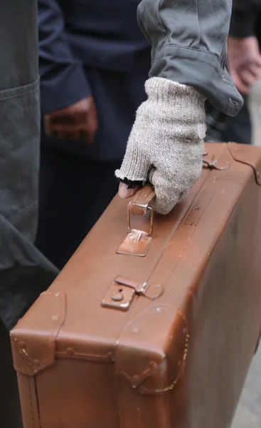 Old leather suitcase and the broken glove — Stock Photo, Image