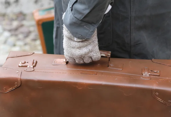 immigrated with old leather suitcase