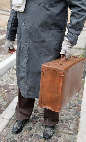 Immigrated with old leather suitcase — Stock Photo, Image