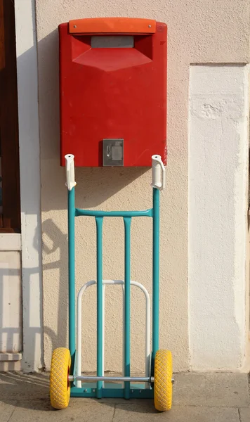 Big Red mailbox with cart for transporting — Stock Photo, Image