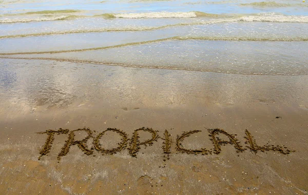 Tropiska skrivet på sandstranden — Stockfoto