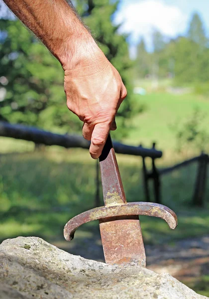 Excalibur sword and the hand of arthur — Stock Photo, Image