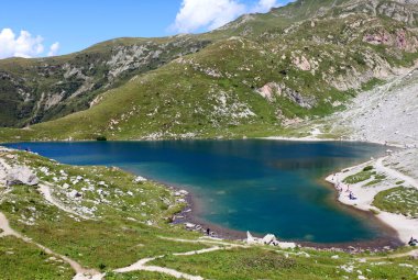 Little Alpine lake called VOLAIA in the border between Italy and Austria and the mountains clipart