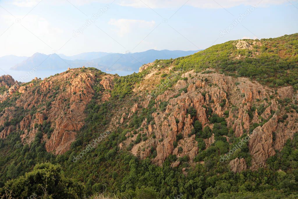incredible red badlands  called Calanques de Piana of western Corsica in summer