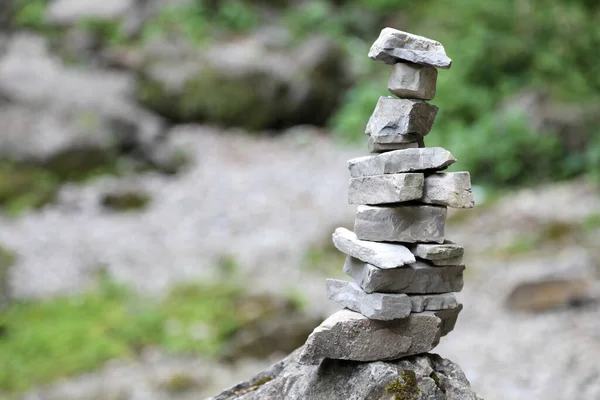 High pile of stones in the mountains called by mountaineers CAIRN or a little man symbol of prayer or to indicate a path