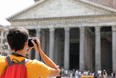 young tourist photographer caught souvenir photos at the great ancient temple of the Pantheon in Rome capital of Italy