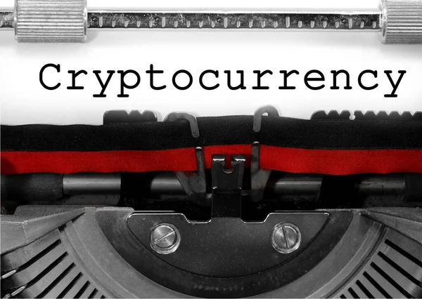 Cryptocurrency written with an old typewriter on white paper