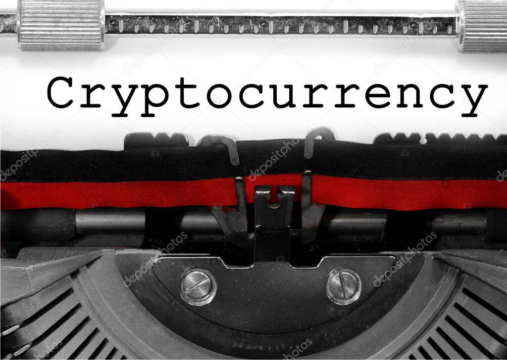 Cryptocurrency written with an old typewriter on white paper