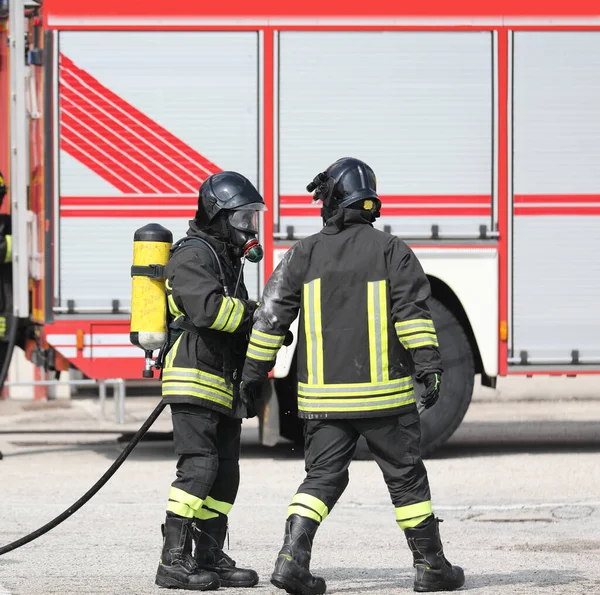 Two Firefighters Uniform Self Contained Oxygen Cylinder Emergency Fire Truck — Stock Photo, Image