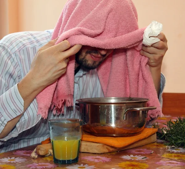 adult man with towel breathe balsam vapors