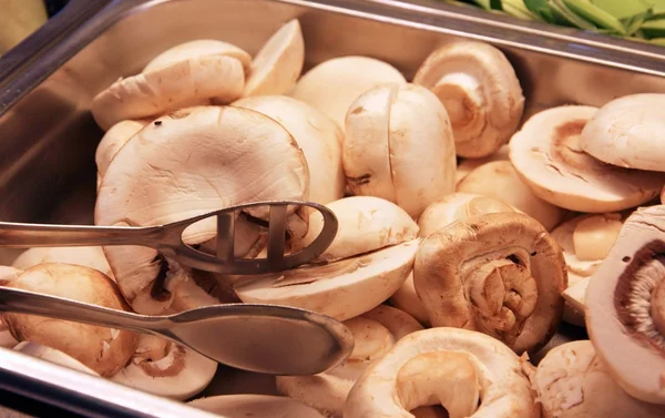 Champignons mushrooms  in the tray at the restaurant — Stock Photo, Image