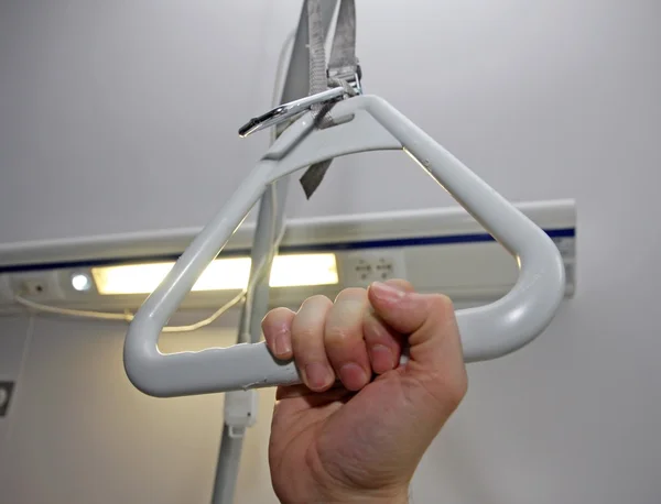 Hand of a the patient that pops up from a bed — Stock Photo, Image