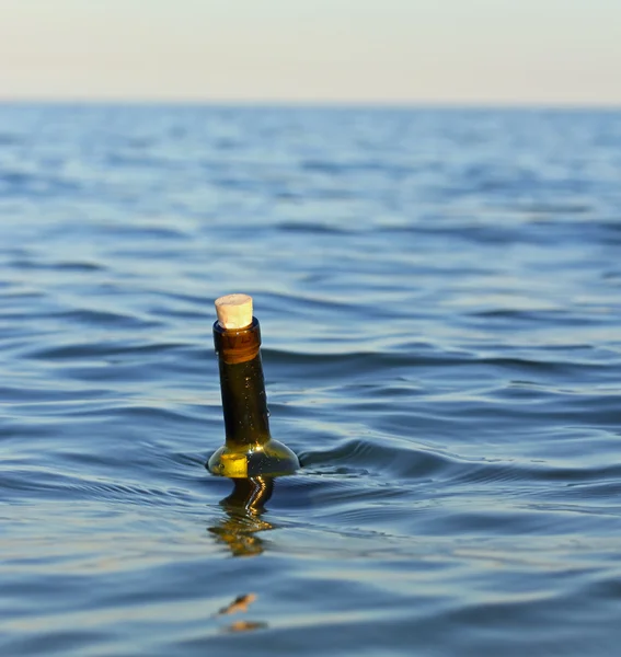 bottle with a secret message in the middle of the ocean