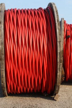 rolls of high-voltage power cable in the power station clipart