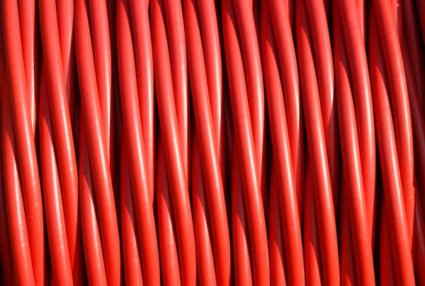 Фон из красного электрического кабеля изоляции резины — стоковое фото