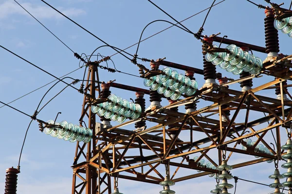 Insulators and electric cables in a large power plant with tall — Stock Photo, Image