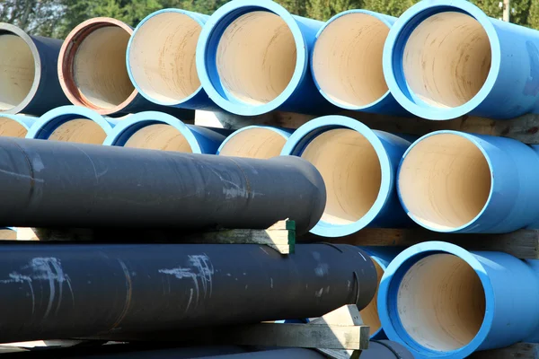 Blue tubes for waterworks and sewer system of the city — Stock Photo, Image