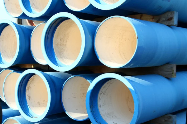 Blue tubes for waterworks and sewer system of the city — Stock Photo, Image