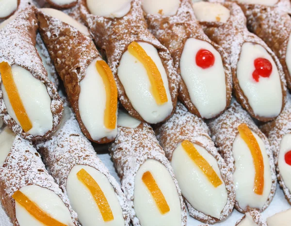 Sicilian cannoli with the icing and candied orange peel and swee — Stock Photo, Image
