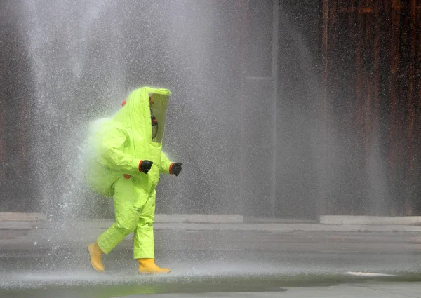 Soldier with yellow suit protective radiation defense against bi — Stock Photo, Image