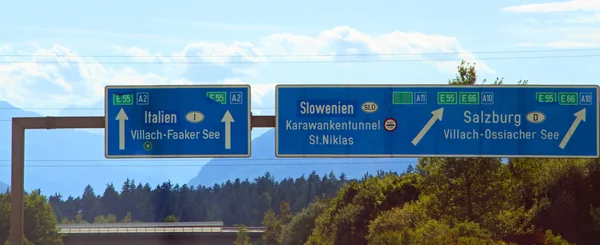 Highway sign in austria near the Italian border — Stock Photo, Image