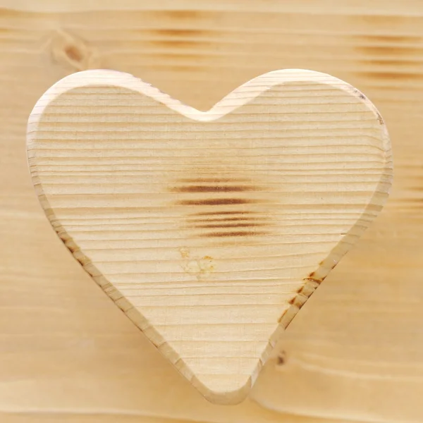 Heart symbol inlaid in wood — Stock Photo, Image