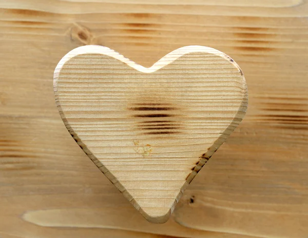 Heart symbol inlaid in natural wood — Stock Photo, Image