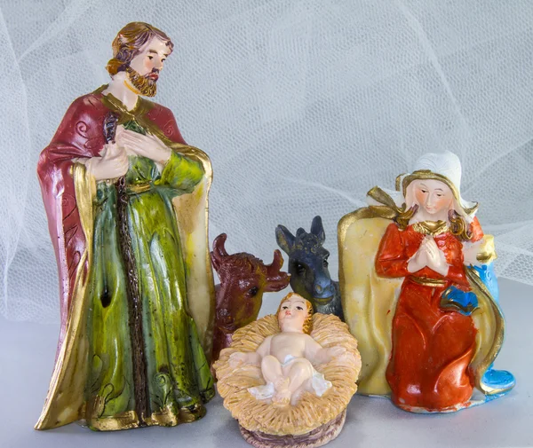 Kerststal met baby Jezus in de kribbe en witte achtergrond — Stockfoto