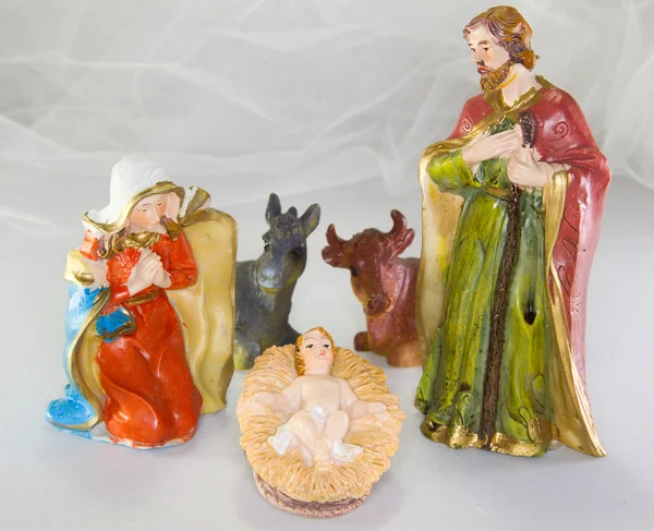 Nativity scene with baby Jesus in the crib and white background — Stock Photo, Image