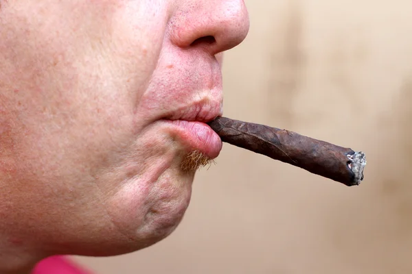 Smoker with big cigar in his mouth — Stock Photo, Image