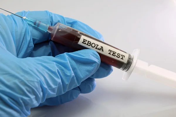 Blood sample of ebola virus on a syringe — Stock Photo, Image