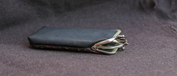 Large glasses of an elder and the black leather case — Stock Photo, Image