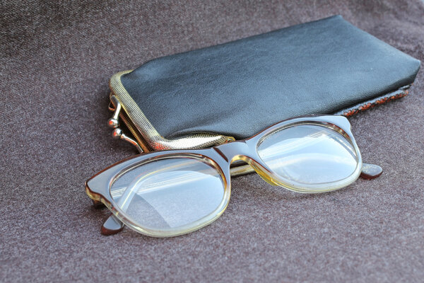old glasses of an old woman with black leather case