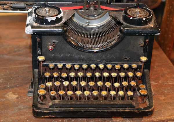 ancient black rusty typewriter used by typists than once
