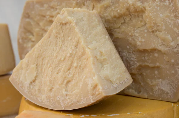 Tasty seasoned Italian cheese for sale in dairy — Stock Photo, Image