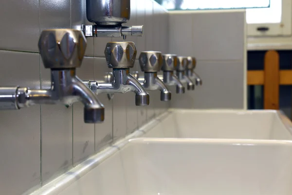 Many Bath Taps of a nursery for children — Stock Photo, Image