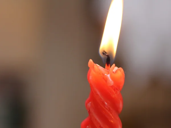 Red candle lit to celebrate Christmas day — Stock Photo, Image