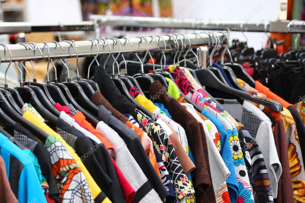vintage clothes of many colors for sale at flea market