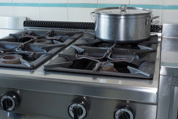 Pot over the stove of industrial kitchen in stainless steel — Stock Photo, Image