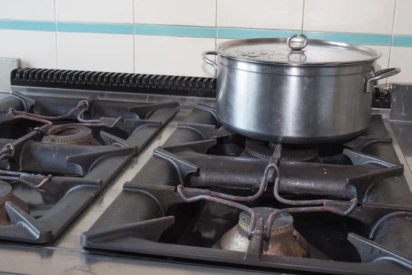 Steel big pot over the stove of industrial kitchen — Stock Photo, Image