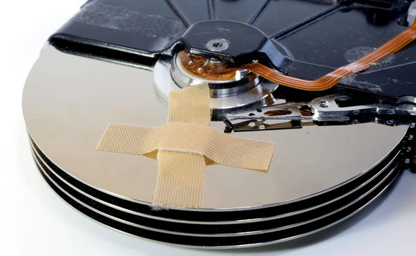 Broken hard drives with a band-aid — Stock Photo, Image