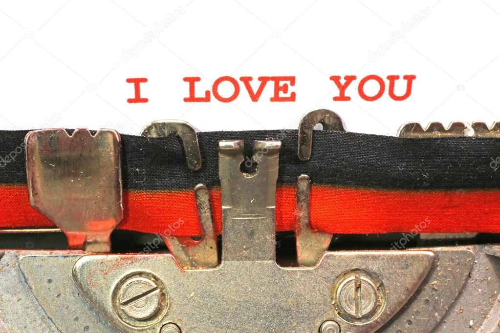 written typewriter I LOVE YOU with red ink