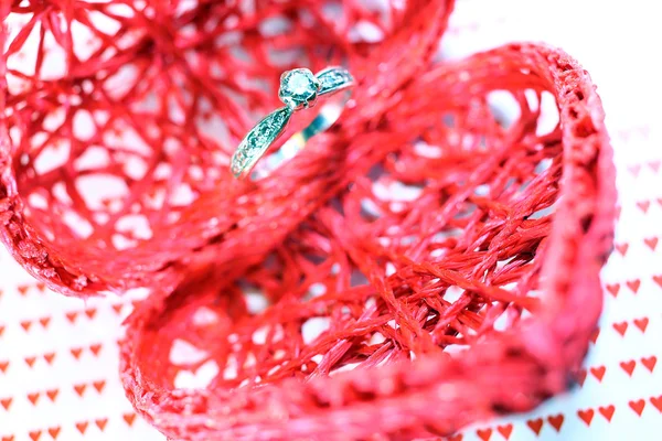 Heart-shaped container and diamond engagement ring — Stock Photo, Image